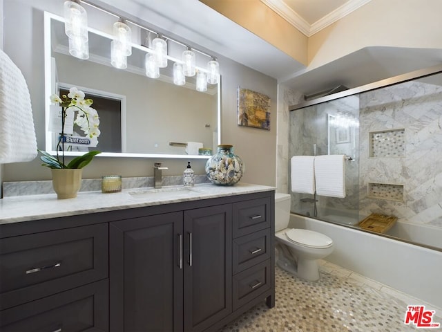 full bathroom featuring crown molding, enclosed tub / shower combo, vanity, tile patterned floors, and toilet