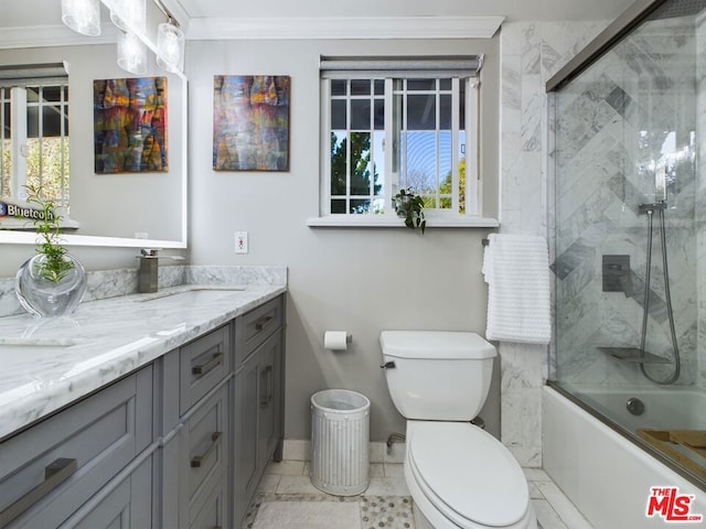 full bathroom featuring crown molding, vanity, toilet, and a wealth of natural light