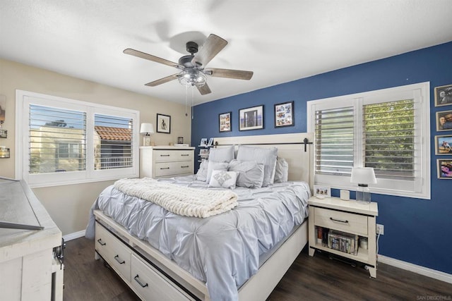 bedroom featuring ceiling fan and dark hardwood / wood-style floors