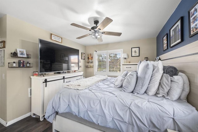 bedroom featuring ceiling fan and dark hardwood / wood-style flooring