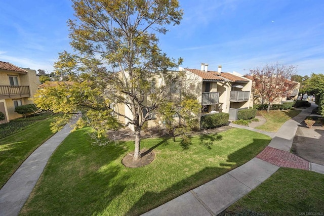 view of community featuring a yard