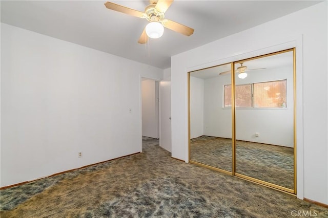 unfurnished bedroom with ceiling fan, a closet, and carpet floors