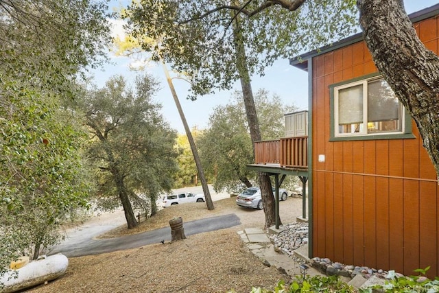 view of yard with a balcony