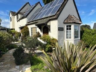 view of home's exterior with solar panels