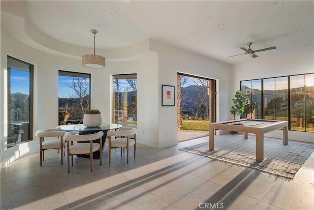 playroom with ceiling fan, a raised ceiling, and billiards