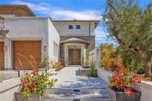 view of front of property featuring a garage