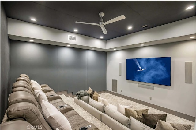 home theater room featuring ceiling fan and carpet flooring