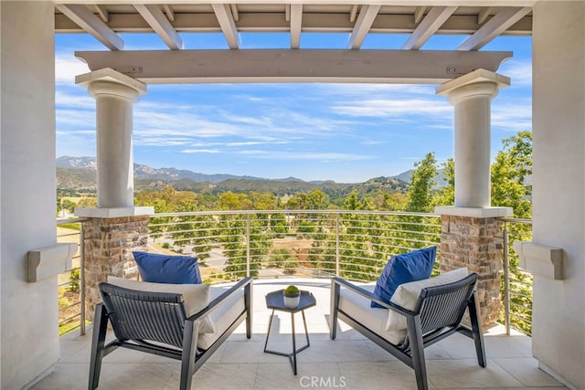 balcony featuring a mountain view