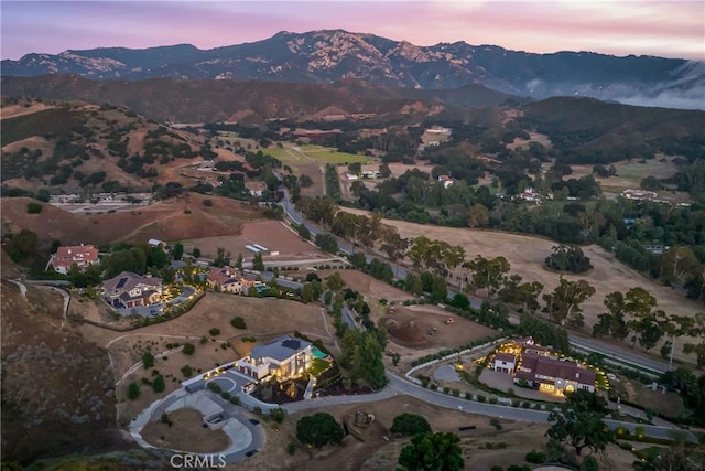 aerial view at dusk with a mountain view