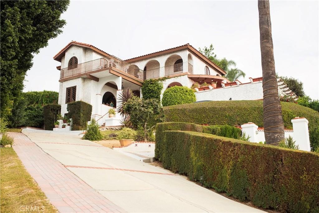 mediterranean / spanish house with a balcony