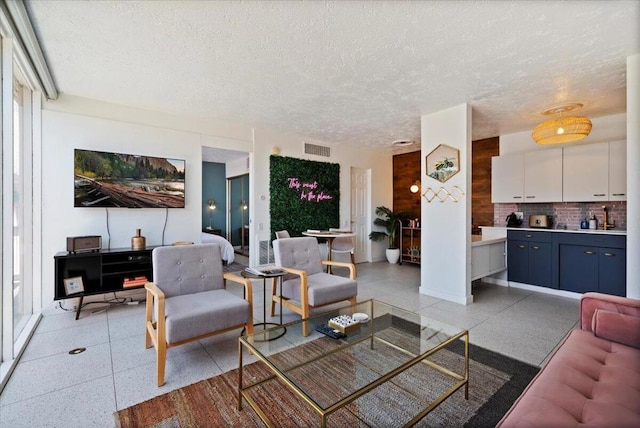 living room with a textured ceiling