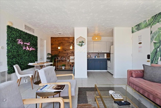 living room featuring a textured ceiling