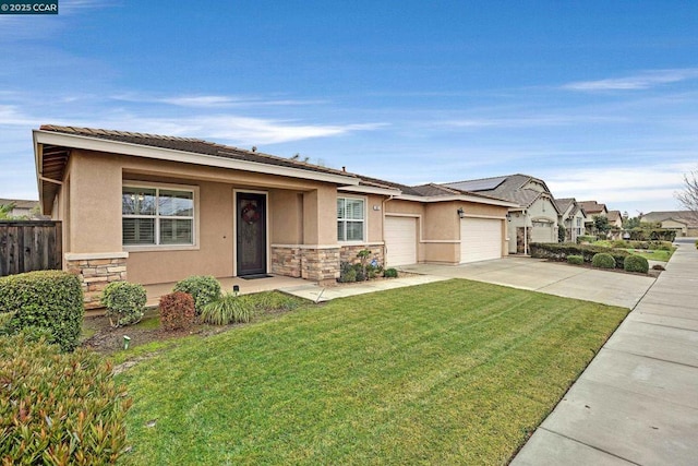 view of front facade with a garage and a front lawn