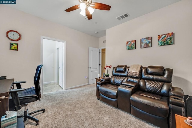 home office featuring ceiling fan and light colored carpet