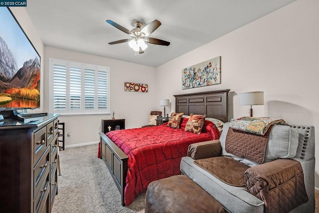 bedroom with ceiling fan and light colored carpet