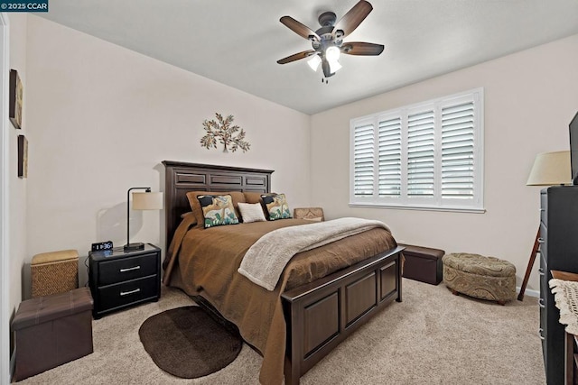 bedroom featuring ceiling fan and light colored carpet