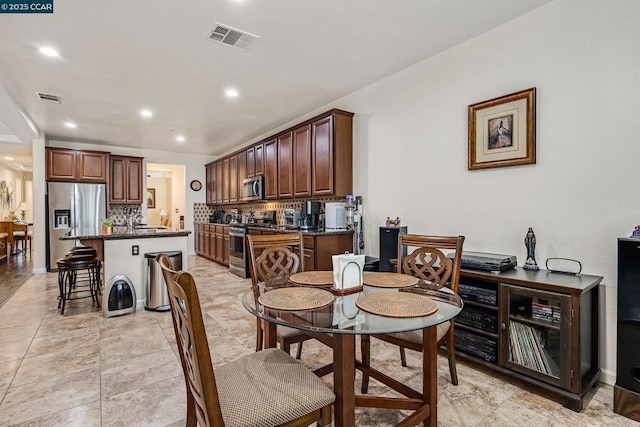 dining room featuring sink