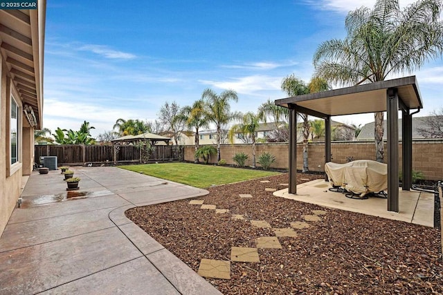 view of yard with a gazebo, cooling unit, and a patio