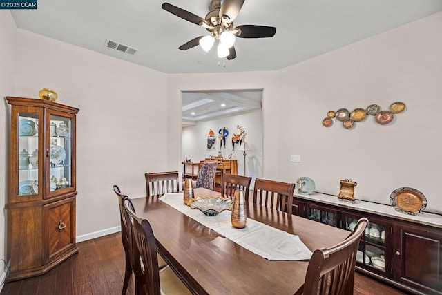 dining area featuring ceiling fan and dark wood-type flooring