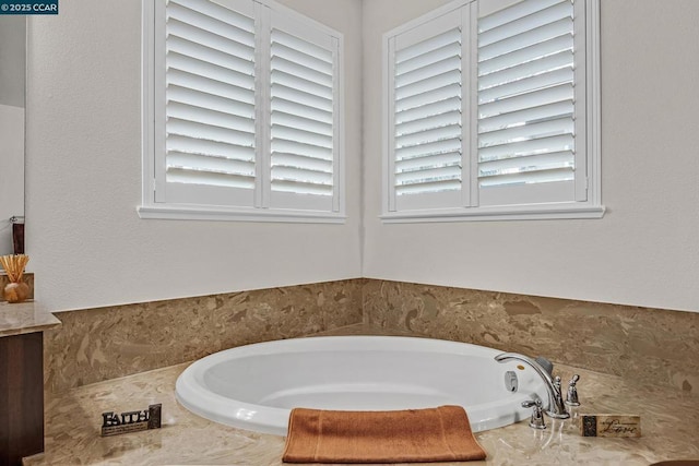 bathroom featuring a relaxing tiled tub