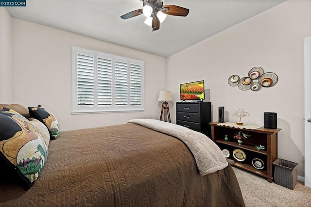 bedroom featuring ceiling fan and carpet