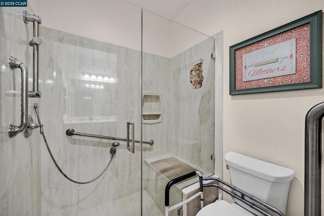 bathroom with an enclosed shower and toilet