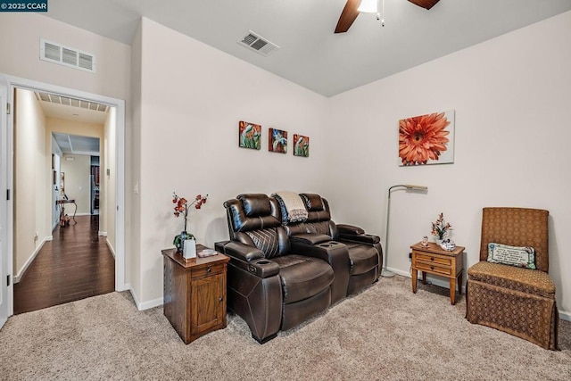 living room featuring ceiling fan and carpet floors