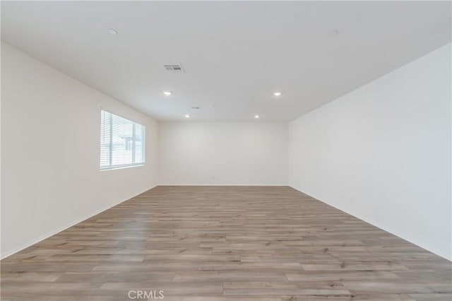 empty room with light wood-type flooring