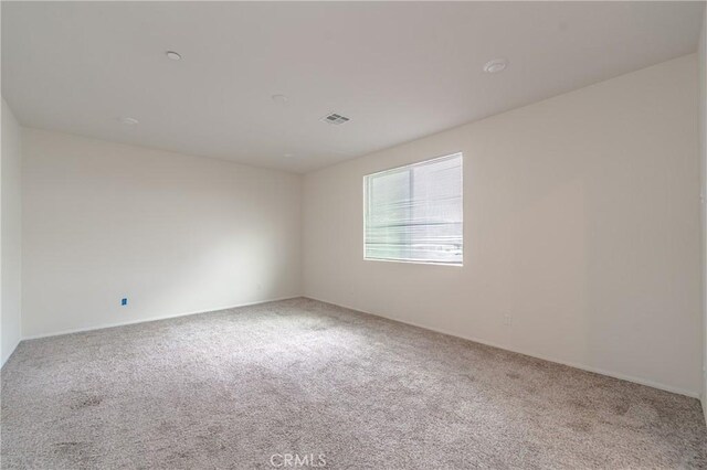 empty room featuring carpet floors