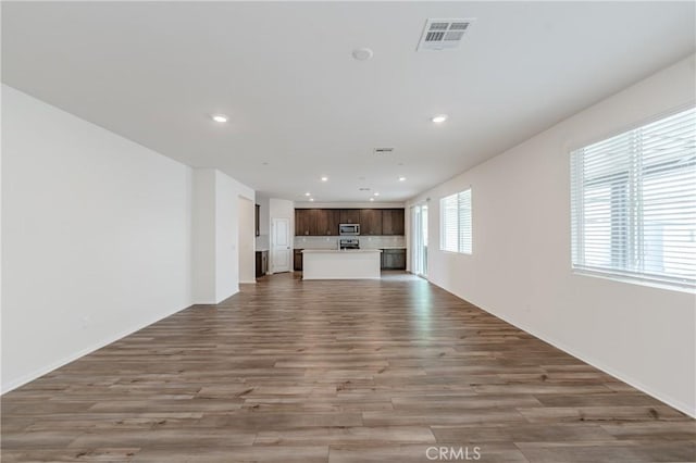 unfurnished living room with light hardwood / wood-style floors