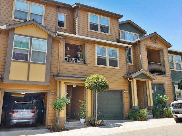 townhome / multi-family property featuring a garage