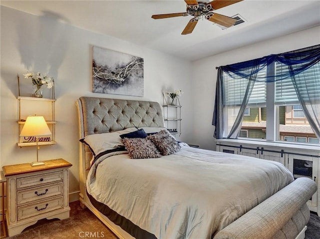 bedroom with ceiling fan and carpet floors