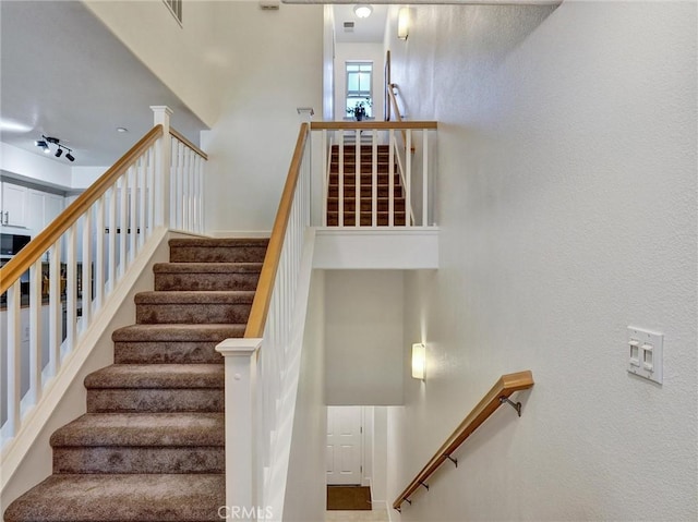 stairs with a high ceiling