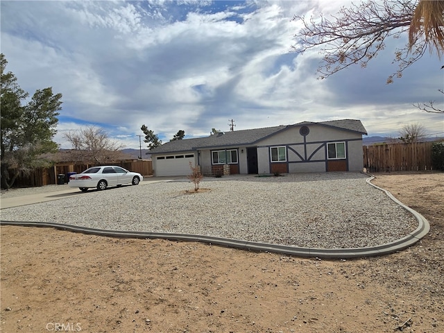 single story home featuring a garage