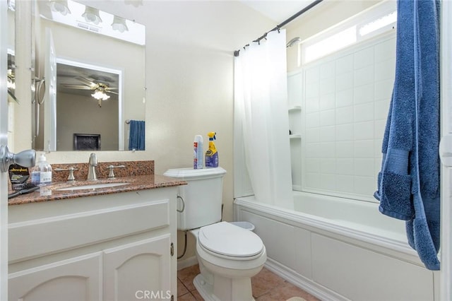 full bathroom with toilet, ceiling fan, tile patterned flooring, shower / bath combination with curtain, and vanity