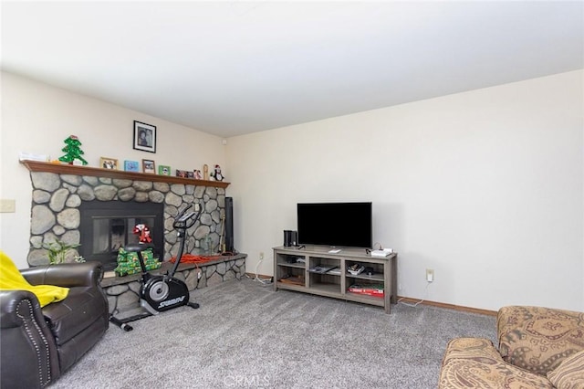 living room featuring light colored carpet and a stone fireplace