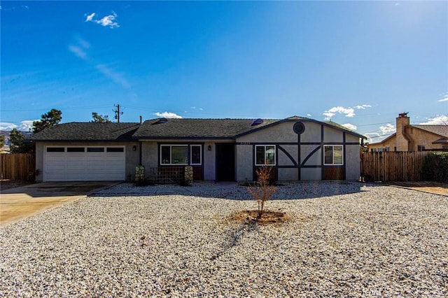 ranch-style home featuring a garage