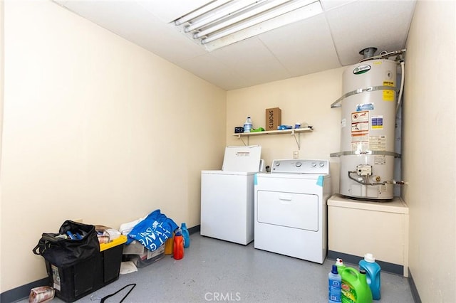 washroom featuring secured water heater and washing machine and clothes dryer