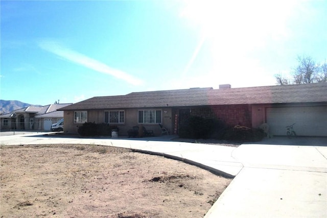 single story home with a garage