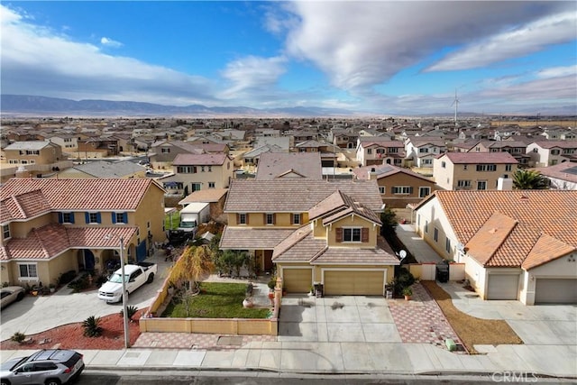 birds eye view of property featuring a mountain view