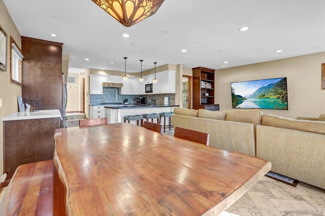 dining room featuring sink