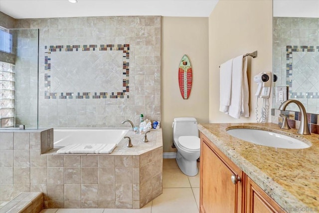 bathroom featuring vanity, toilet, tiled tub, and tile patterned flooring