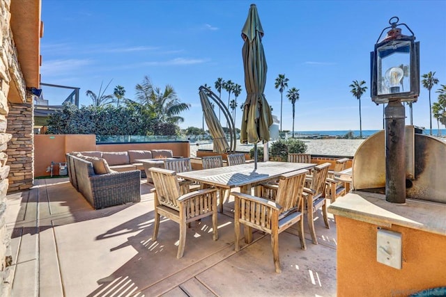 view of patio / terrace featuring an outdoor living space and a water view