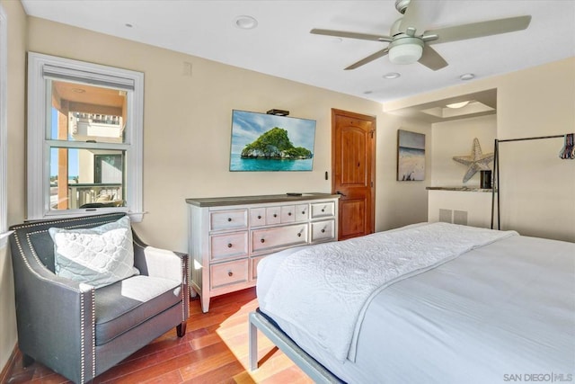 bedroom with ceiling fan and hardwood / wood-style floors