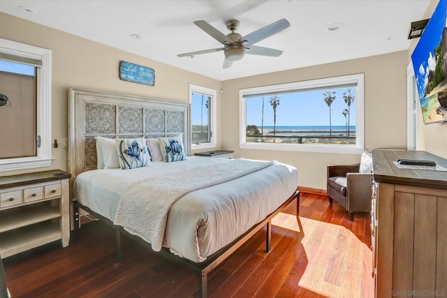 bedroom featuring ceiling fan and hardwood / wood-style flooring