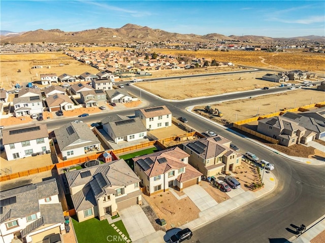 birds eye view of property with a mountain view