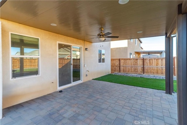 view of patio featuring ceiling fan