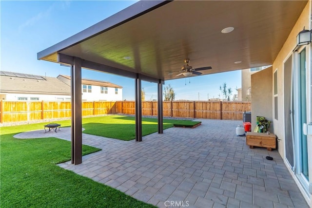 view of patio featuring ceiling fan