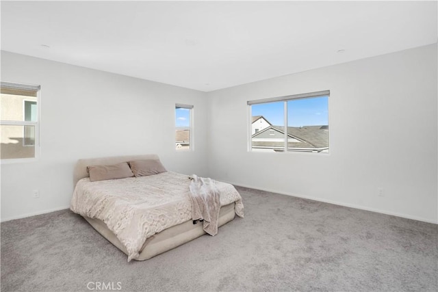 bedroom with light carpet