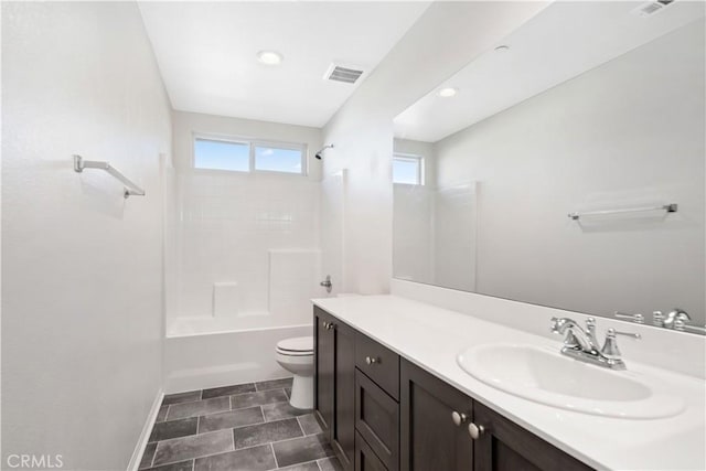 full bathroom featuring toilet, vanity, and shower / bath combination